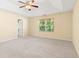 An airy bedroom showcases neutral walls, a ceiling fan, and natural lighting at 3845 New Salem Ct, Cumming, GA 30040