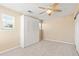 A modern bedroom features a ceiling fan and Murphy bed for flexible space usage at 3845 New Salem Ct, Cumming, GA 30040