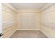 A walk-in closet with custom shelving and carpeted floors provides ample storage space at 3845 New Salem Ct, Cumming, GA 30040