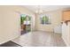 Bright dining area featuring tile floors, a sliding glass door, and ample natural light at 3845 New Salem Ct, Cumming, GA 30040