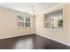 Inviting dining room with dark hardwood floors, and large windows offering plenty of natural light at 3845 New Salem Ct, Cumming, GA 30040