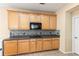 Kitchen featuring granite countertops, stainless steel appliances, and ample cabinet space at 3845 New Salem Ct, Cumming, GA 30040