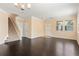 Large, open living room with hardwood floors, neutral walls, and staircase visible to the side at 3845 New Salem Ct, Cumming, GA 30040
