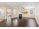 Spacious living room featuring dark hardwood floors and great light with an open layout at 3845 New Salem Ct, Cumming, GA 30040