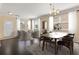 Bright, staged living room with stylish furniture, hardwood floors, and natural light through large windows at 3845 New Salem Ct, Cumming, GA 30040