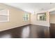 Spacious living area featuring hardwood floors, large windows, and an open layout perfect for entertaining at 3845 New Salem Ct, Cumming, GA 30040