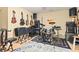 The music room features wood flooring, guitars hanging on the wall, and a drum set at 3845 New Salem Ct, Cumming, GA 30040