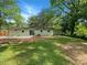 Spacious backyard with lush greenery and a patio area for outdoor enjoyment at 4239 Canby Ln, Decatur, GA 30035