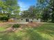 Lush backyard featuring mature trees and a serene outdoor space at 4239 Canby Ln, Decatur, GA 30035
