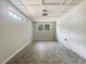 Finished basement with painted brick wall and windows for natural light at 4239 Canby Ln, Decatur, GA 30035
