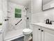 Bathroom featuring a marble shower, sleek fixtures and modern vanity at 4239 Canby Ln, Decatur, GA 30035