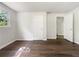 Bedroom featuring hardwood floors, light walls, and a closet for ample storage at 4239 Canby Ln, Decatur, GA 30035