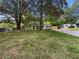 Charming single-story home featuring mature trees and a well-manicured lawn at 4239 Canby Ln, Decatur, GA 30035