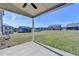 Inviting covered patio overlooking a spacious, well-maintained backyard at 58 Longhorn Way, Auburn, GA 30011