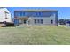 Sprawling backyard with a covered patio, blending indoor and outdoor living at 58 Longhorn Way, Auburn, GA 30011