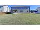 Expansive backyard featuring a covered patio perfect for outdoor enjoyment at 58 Longhorn Way, Auburn, GA 30011