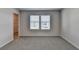 Inviting bedroom features soft carpet, large window, and easy closet access at 58 Longhorn Way, Auburn, GA 30011