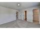 Comfortable carpeted bedroom featuring neutral walls and convenient bathroom access at 58 Longhorn Way, Auburn, GA 30011