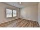 Inviting bedroom boasts wood-look floors and ample natural light from large windows at 58 Longhorn Way, Auburn, GA 30011