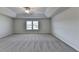 Enormous bedroom offers plush carpeting and a tray ceiling with a ceiling fan at 58 Longhorn Way, Auburn, GA 30011