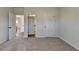 Bedroom featuring carpeted floor and entry doors at 58 Longhorn Way, Auburn, GA 30011