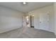 Bedroom with a carpeted floor and two entry doors at 58 Longhorn Way, Auburn, GA 30011
