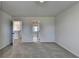 Clean and neutral bedroom with two open doorways and carpet flooring at 58 Longhorn Way, Auburn, GA 30011