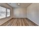 Bright bedroom with wood-look floors and large windows providing great natural light at 58 Longhorn Way, Auburn, GA 30011