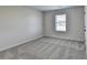 Bedroom featuring neutral colored walls, carpet flooring and natural light at 58 Longhorn Way, Auburn, GA 30011