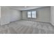 Bonus room featuring carpeted floors, natural light, and neutral paint at 58 Longhorn Way, Auburn, GA 30011