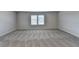 Bonus room featuring carpeted floors, natural light, and neutral paint at 58 Longhorn Way, Auburn, GA 30011