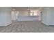Expansive bonus room with carpeted floor and half wall, perfect for entertaining or relaxing at 58 Longhorn Way, Auburn, GA 30011