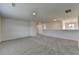 Bright, carpeted bonus room with neutral walls and multiple doorways for flexible use at 58 Longhorn Way, Auburn, GA 30011