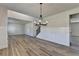 Spacious dining area features wood-look floors and an open concept floor plan at 58 Longhorn Way, Auburn, GA 30011