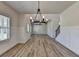 Spacious dining area with open layout, modern lighting, and durable wood-look flooring at 58 Longhorn Way, Auburn, GA 30011