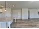 Open floor plan with an island in the kitchen and lots of space for entertaining at 58 Longhorn Way, Auburn, GA 30011
