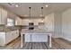 Modern kitchen featuring an island with granite countertops and stainless steel appliances at 58 Longhorn Way, Auburn, GA 30011