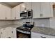Modern kitchen showcasing granite countertops and stainless steel oven at 58 Longhorn Way, Auburn, GA 30011