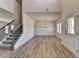 Open-concept space with staircase, a front door and ample windows that provide great natural light at 58 Longhorn Way, Auburn, GA 30011