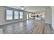 Bright, open-concept living area with modern flooring flowing into a well-appointed kitchen at 58 Longhorn Way, Auburn, GA 30011