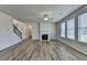 Spacious living room with natural light, fireplace, and hardwood flooring at 58 Longhorn Way, Auburn, GA 30011