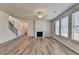 Bright, open living room featuring a staircase, fireplace, and lots of natural light at 58 Longhorn Way, Auburn, GA 30011