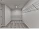 Large walk-in closet features carpet flooring and white wire rack shelving at 58 Longhorn Way, Auburn, GA 30011
