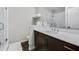 Bright bathroom featuring walk-in shower, quartz counters and dark cabinets at 635 Broadview Ne Pl, Atlanta, GA 30324