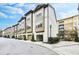 Charming townhome row featuring a brick facade and convenient attached garages, perfect for modern living at 635 Broadview Ne Pl, Atlanta, GA 30324