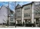 Elegant townhome with brick accents, fenced yard, and well-maintained landscaping at 635 Broadview Ne Pl, Atlanta, GA 30324