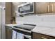 Kitchen with a stainless steel oven and range, quartz countertops and wood cabinets at 635 Broadview Ne Pl, Atlanta, GA 30324