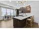 Bright kitchen featuring a breakfast bar, stainless steel appliances, and contemporary lighting at 635 Broadview Ne Pl, Atlanta, GA 30324