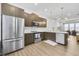 Modern kitchen with stainless steel appliances, stylish cabinets, and island seating at 635 Broadview Ne Pl, Atlanta, GA 30324