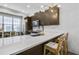 Well-lit kitchen with island, quartz countertops, stainless appliances, and modern accents at 635 Broadview Ne Pl, Atlanta, GA 30324